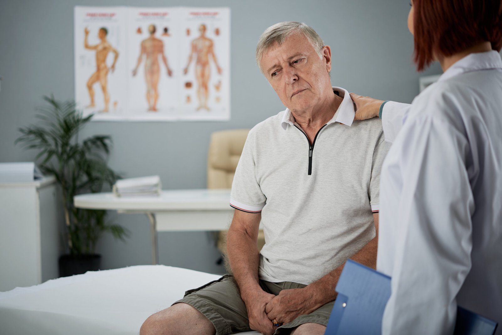 Older man discussing urinary symptoms with a healthcare professional